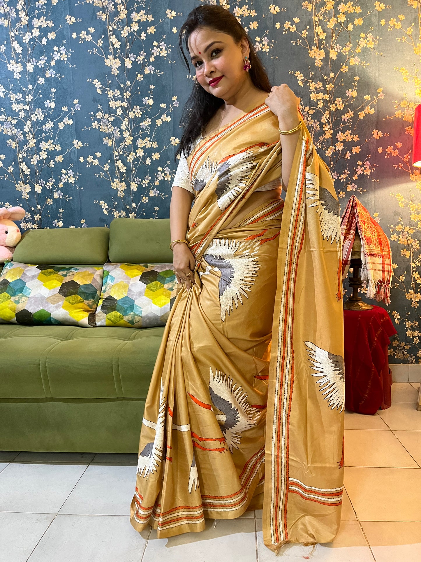 Elegant woman in beige kantha stitch saree showcasing traditional Indian ethnic wear