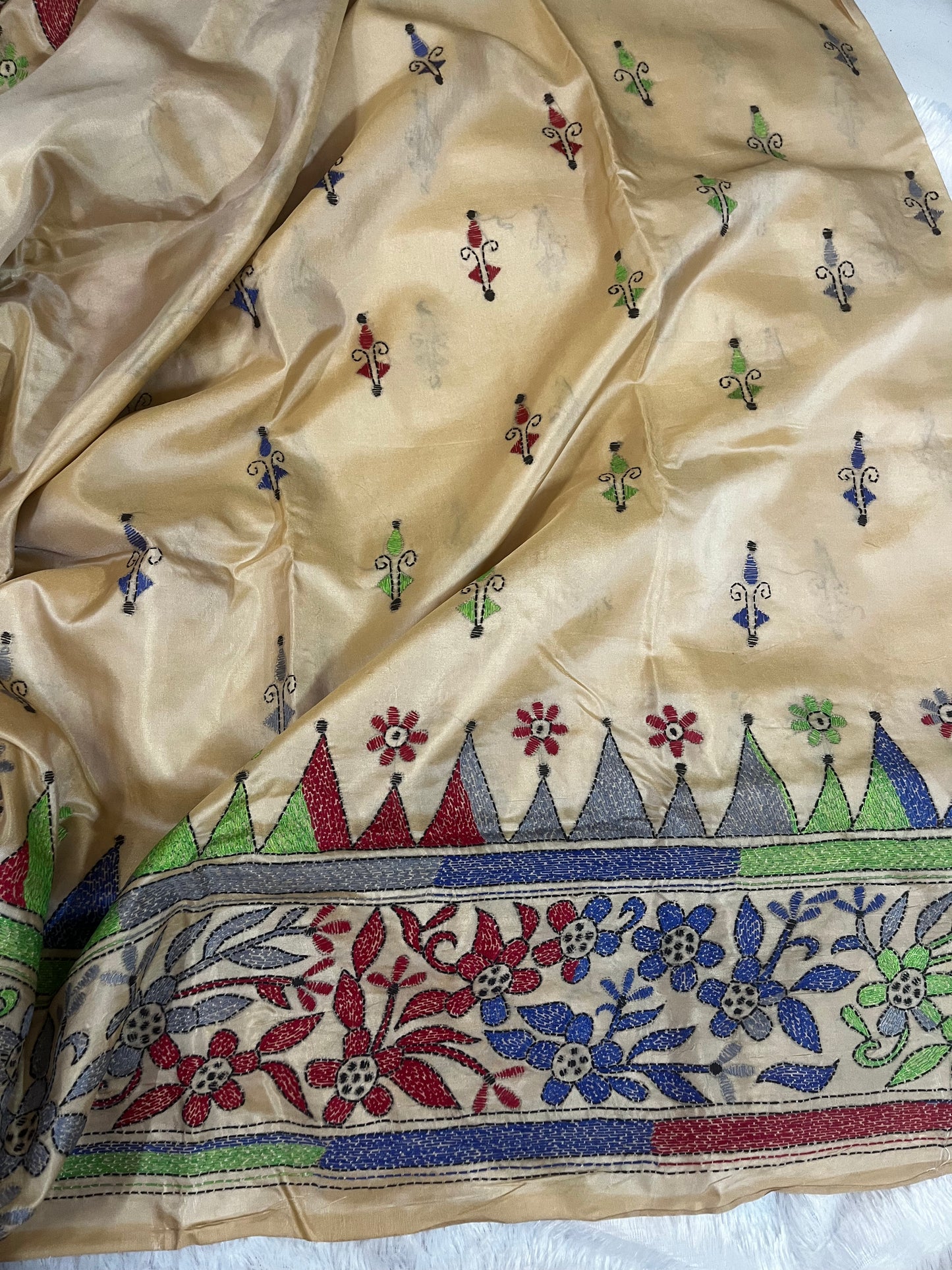 Matching beige blouse piece with coordinating kantha stitch details