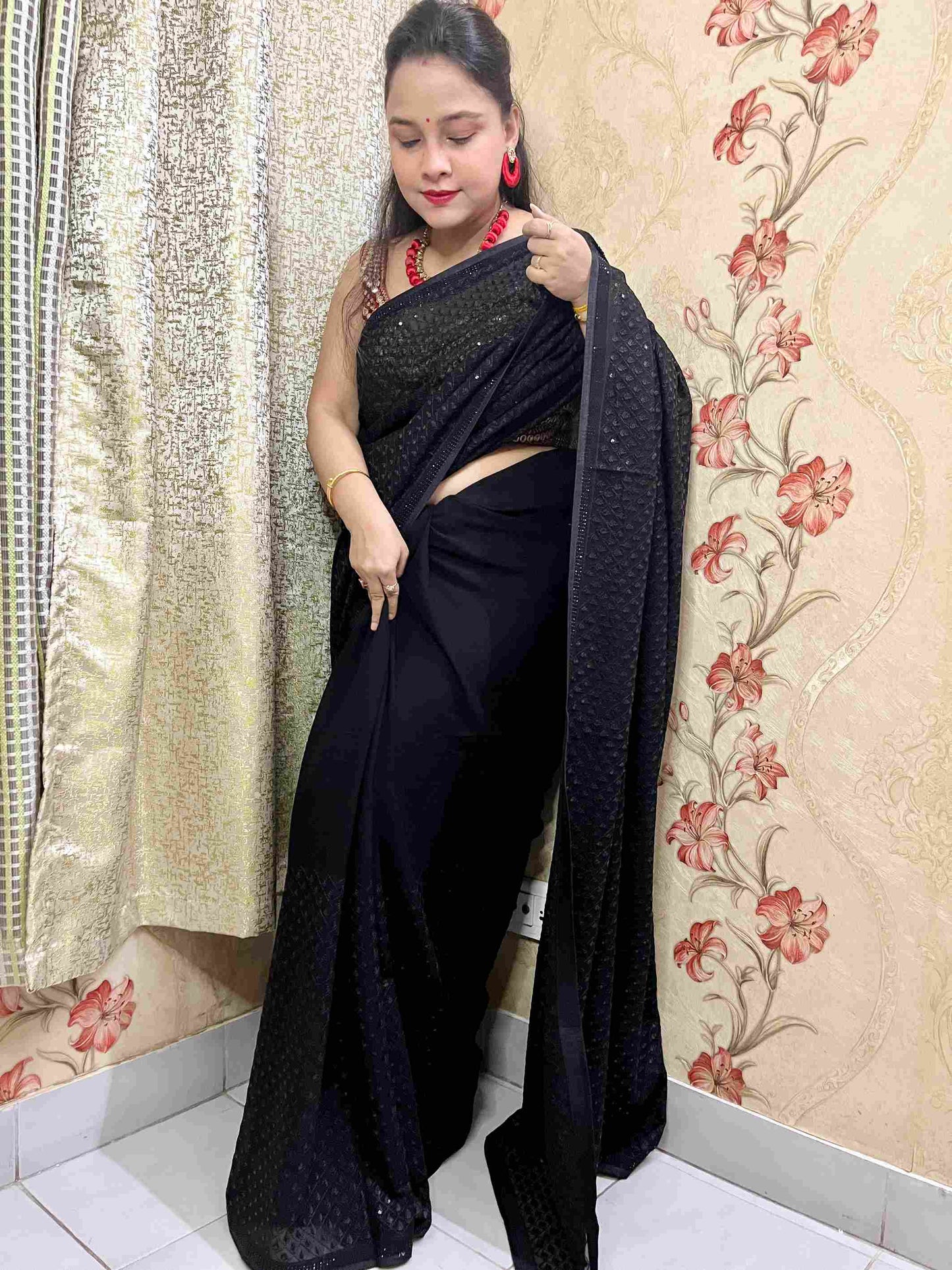 Close-up of Intricate Sequence Work on Black Georgette Fabric