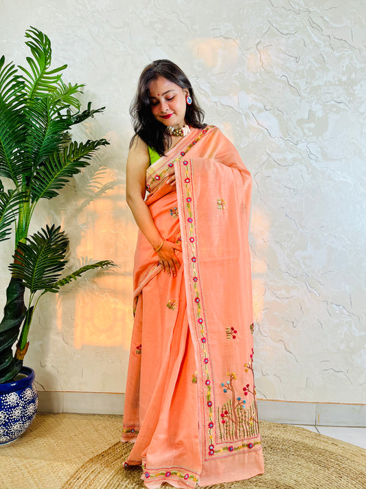 Pastel peach handwoven Chanderi silk cotton saree with hand-stitched floral embroidery, front drape view – Desi Aadat