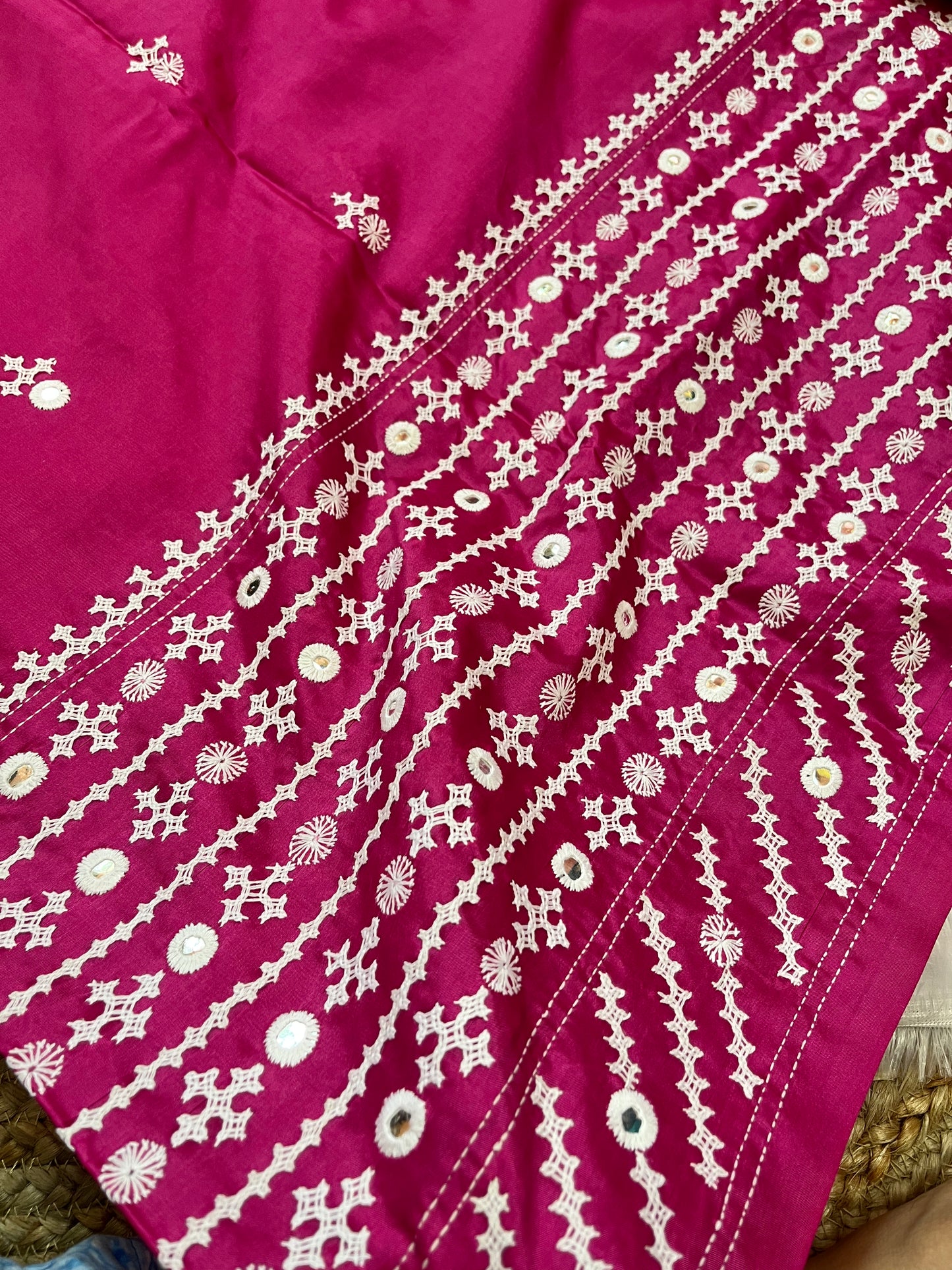 Matching burgundy blouse piece with coordinating Gujarati stitch and royal mirror details
