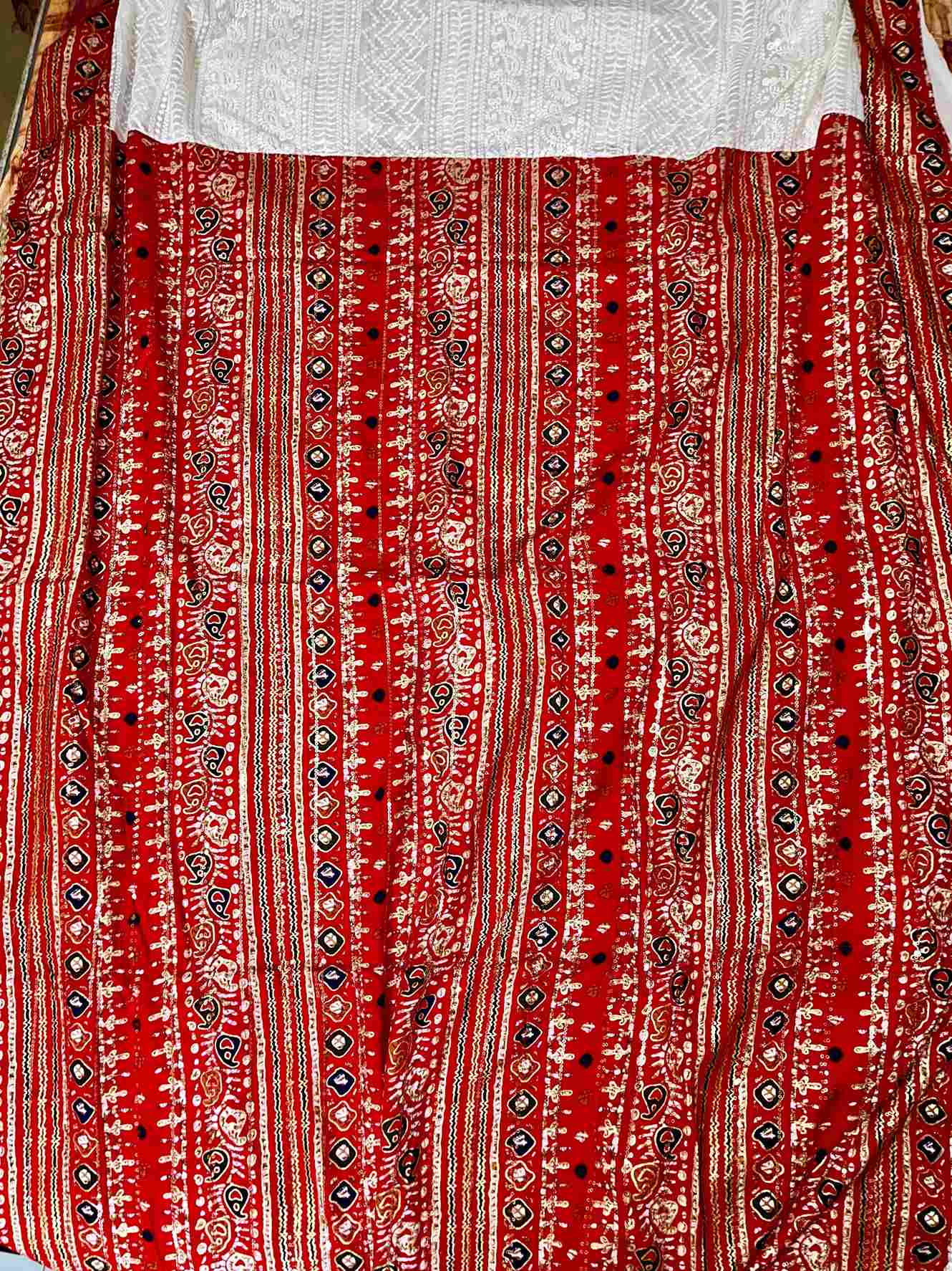 Close-up of Patola and Chikankari embroidery on georgette saree fabric
