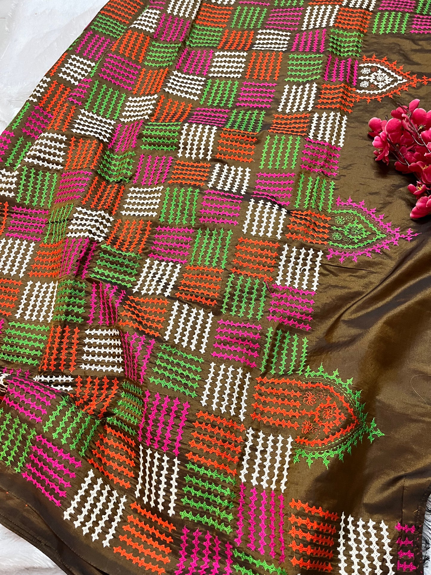 Detailed texture of handwoven fabric with raised multicolor thread Kantha embroidery