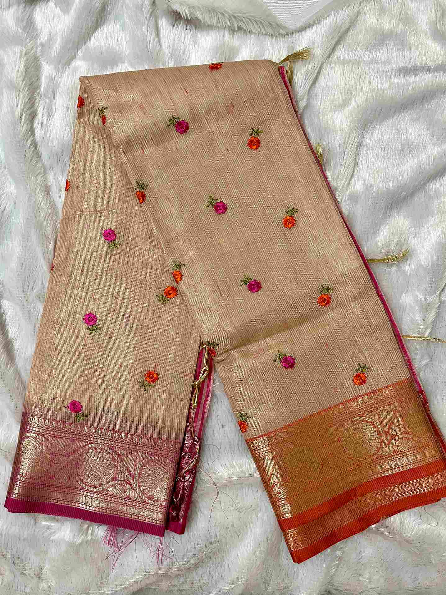 Graceful woman in Pink tissue saree showcasing Desi Aadat’s handwoven design