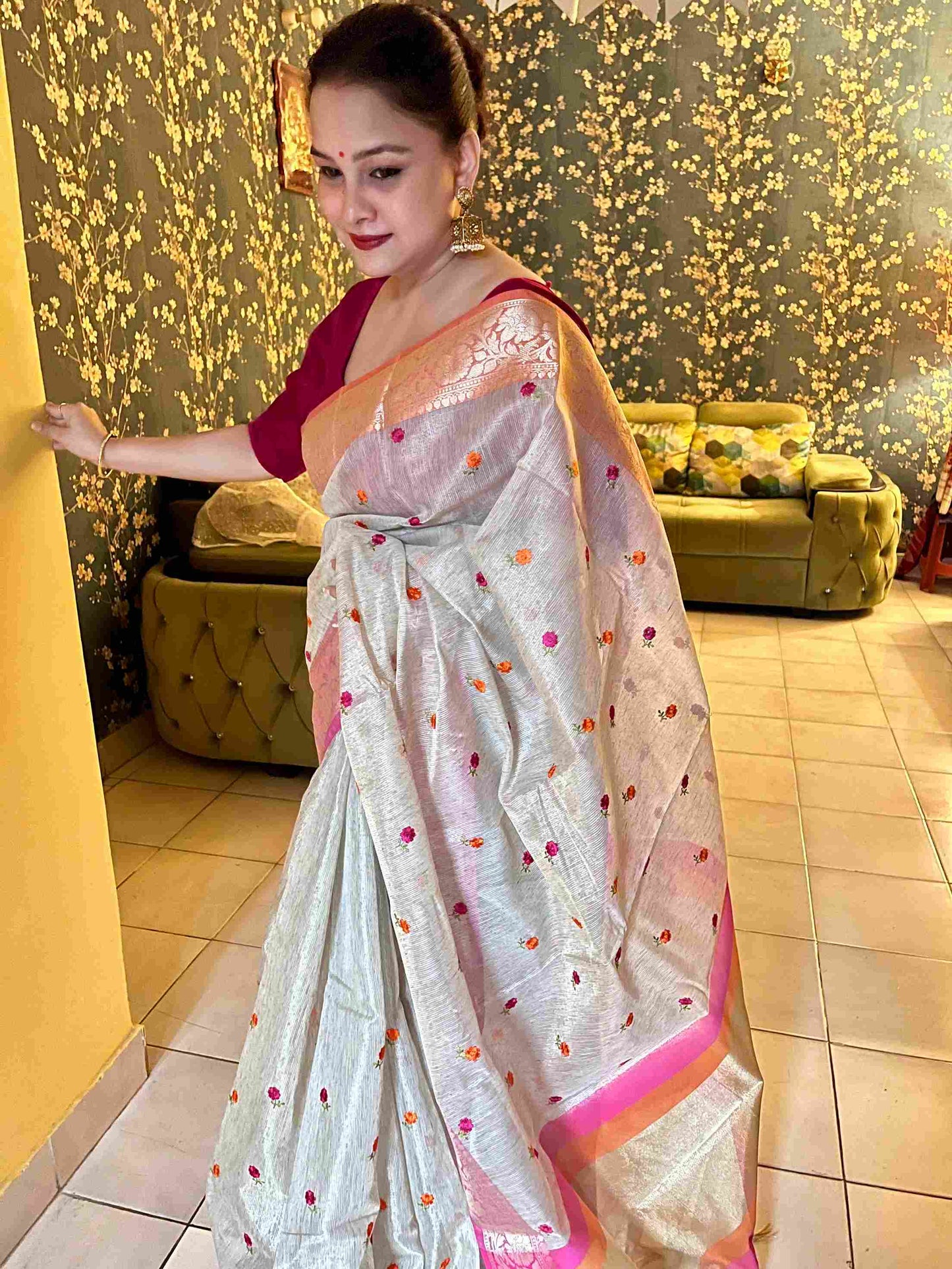 Stylish woman in Beige tissue saree showcasing Desi Aadat’s handwoven design