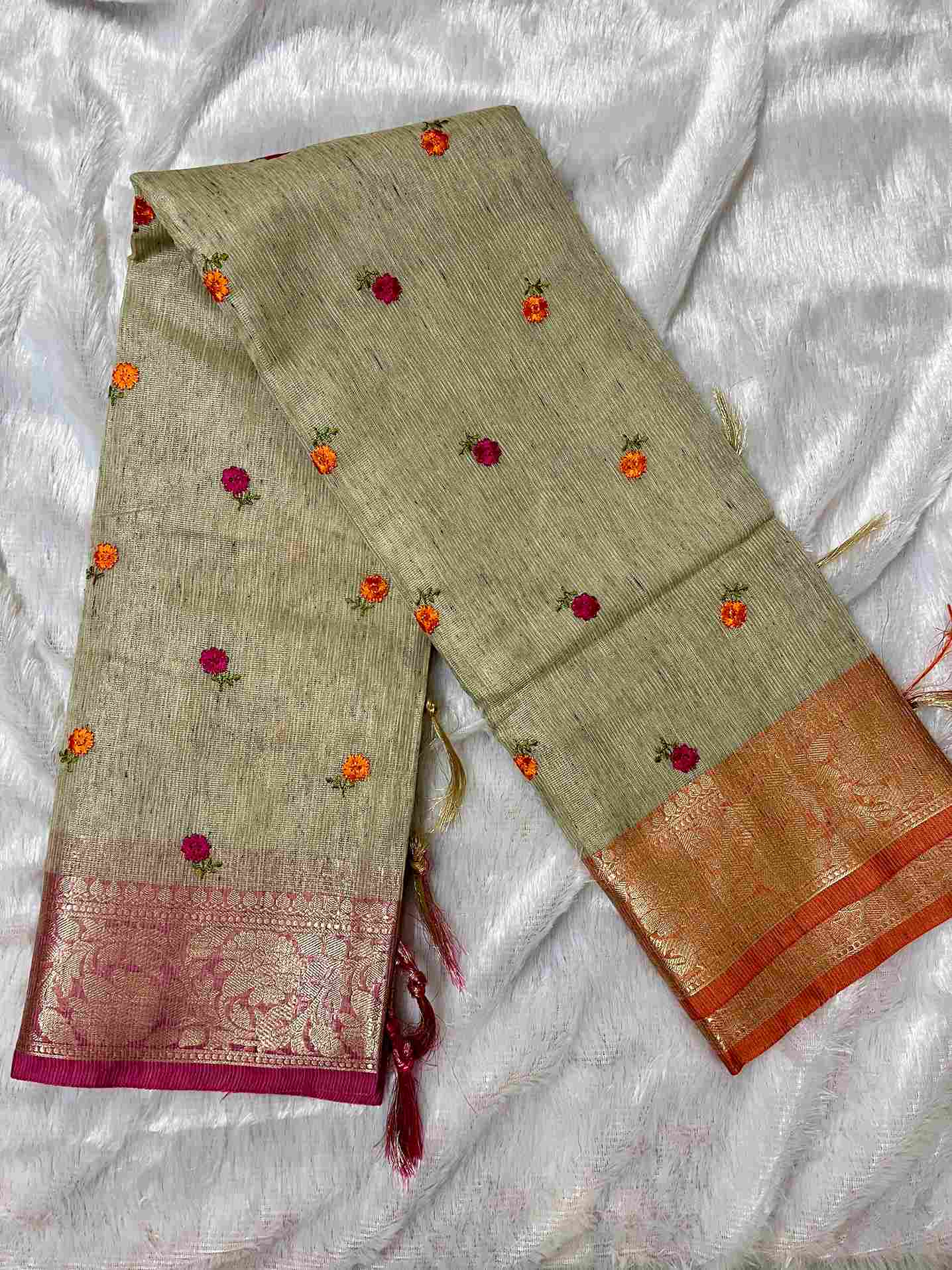 Stylish woman in Beige tissue saree showcasing Desi Aadat’s handwoven design