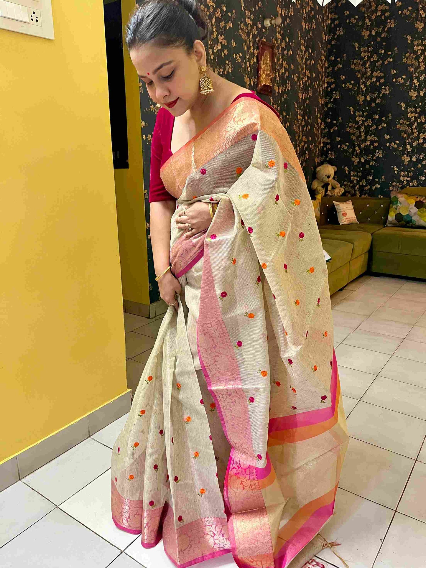 Stylish woman in Beige tissue saree showcasing Desi Aadat’s handwoven design