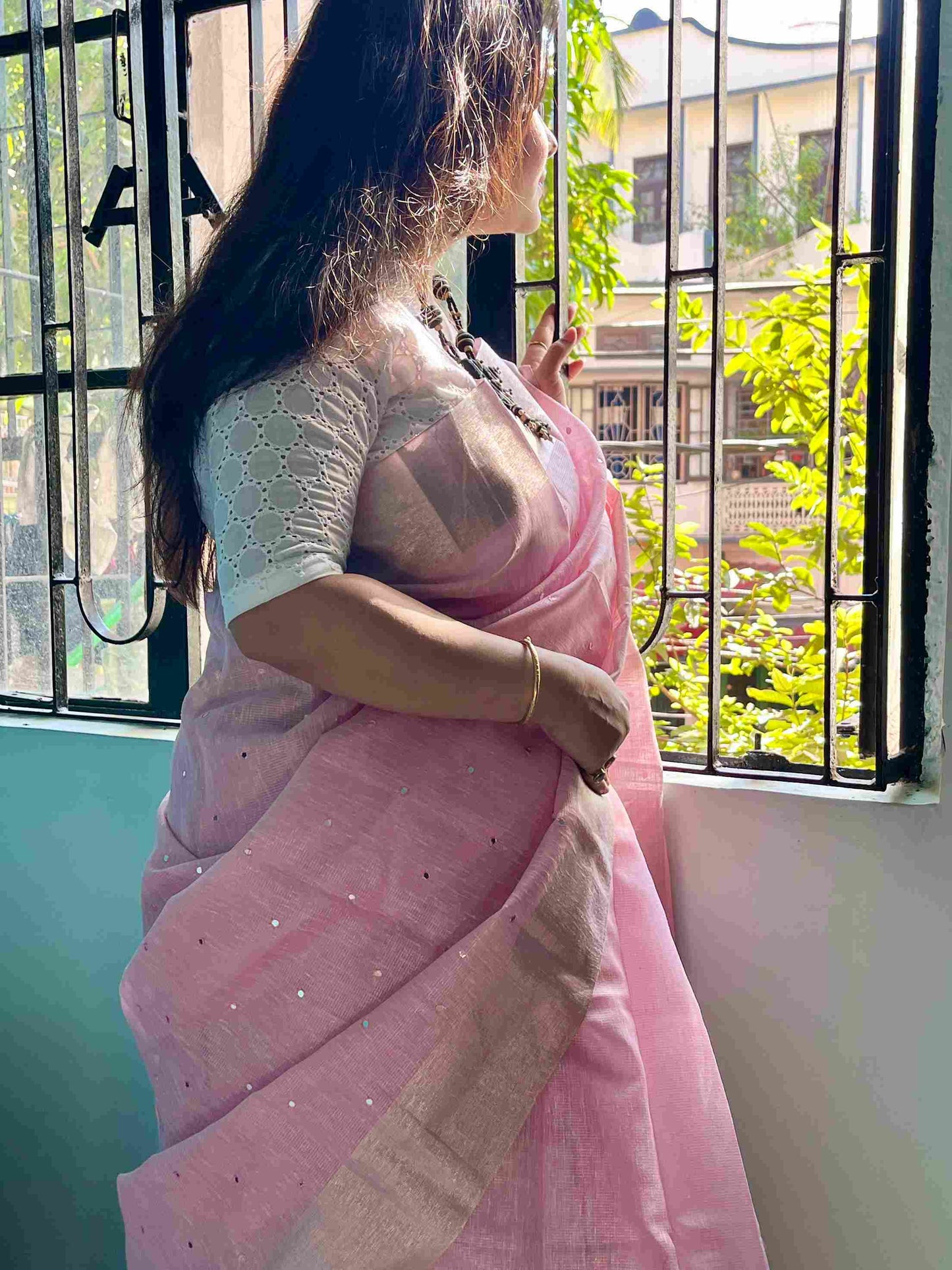 Close-up of mirror work on saree on Baby Pink kota saree cotton fabric