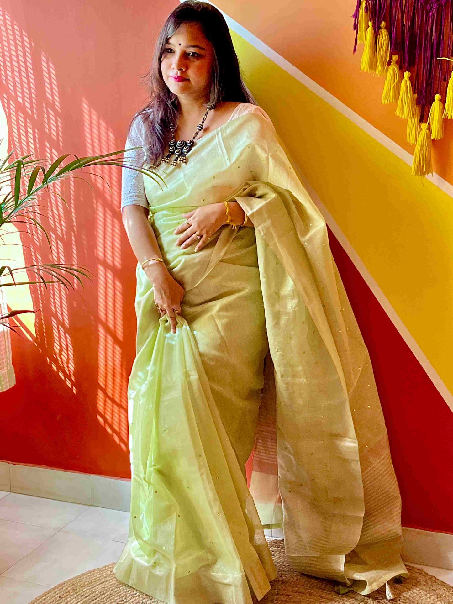 Close-up of mirror work on saree on Pista Green kota saree cotton fabric