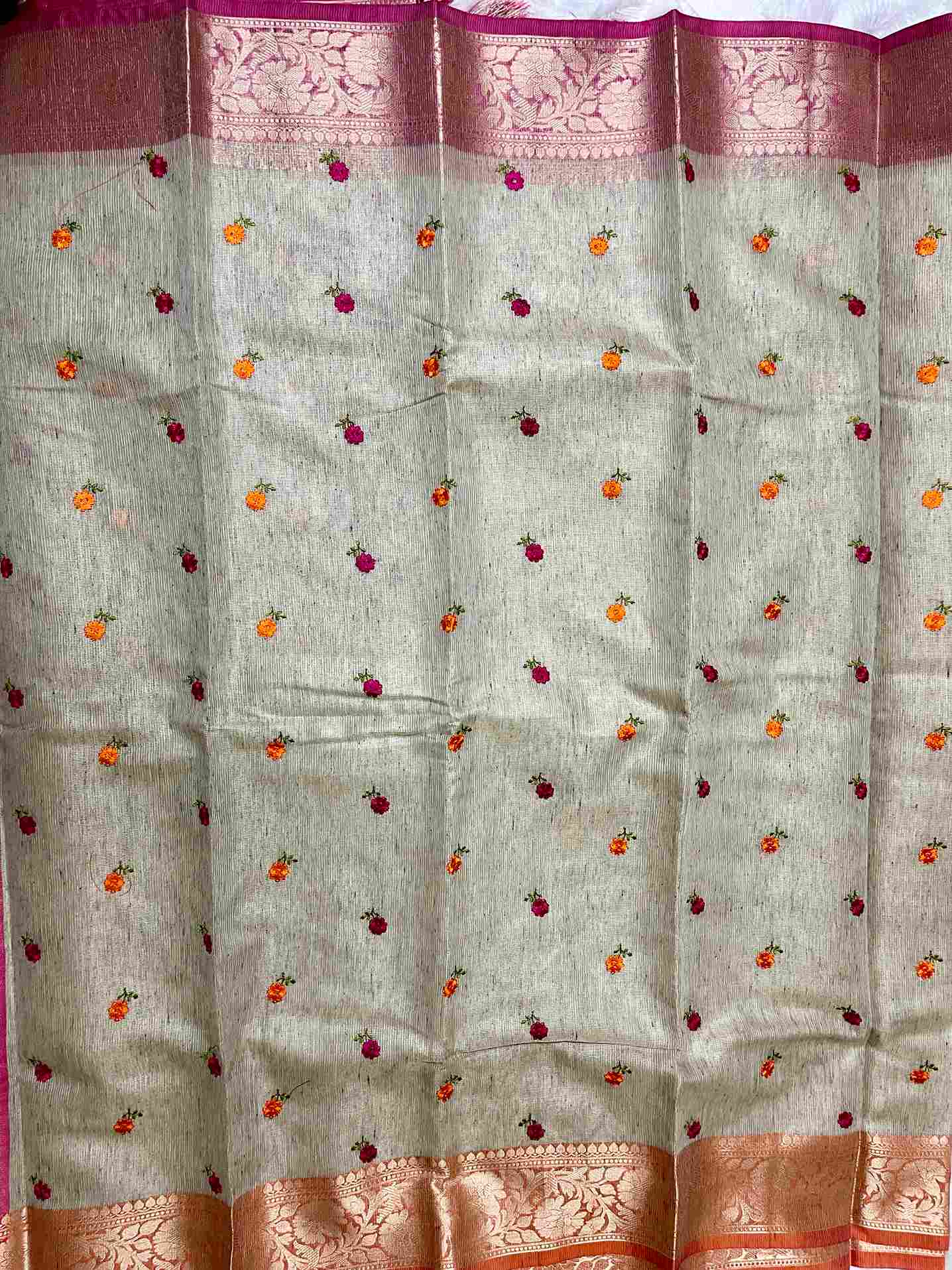 Stylish woman in Beige tissue saree showcasing Desi Aadat’s handwoven design