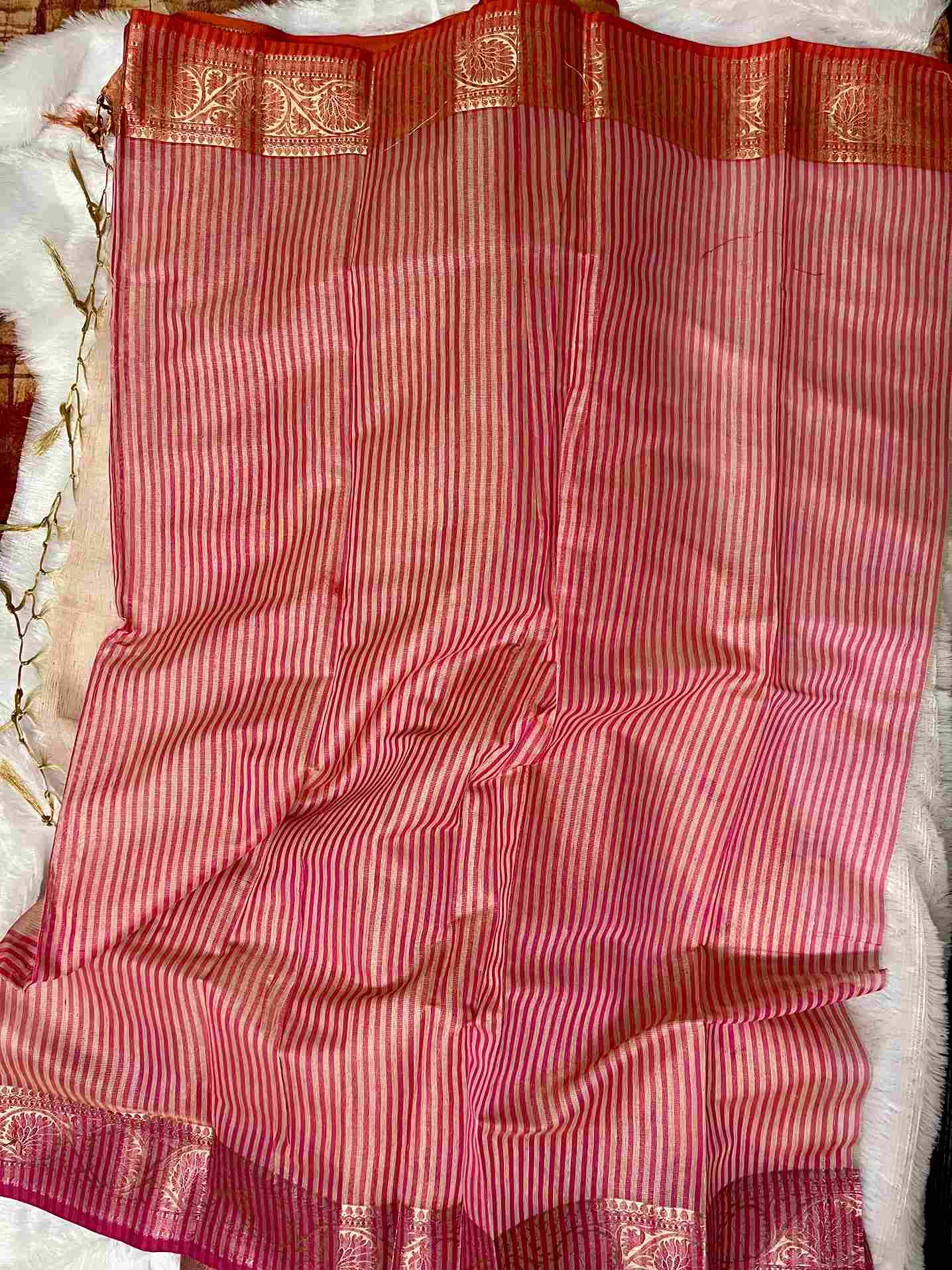 Graceful woman in Pink tissue saree showcasing Desi Aadat’s handwoven design