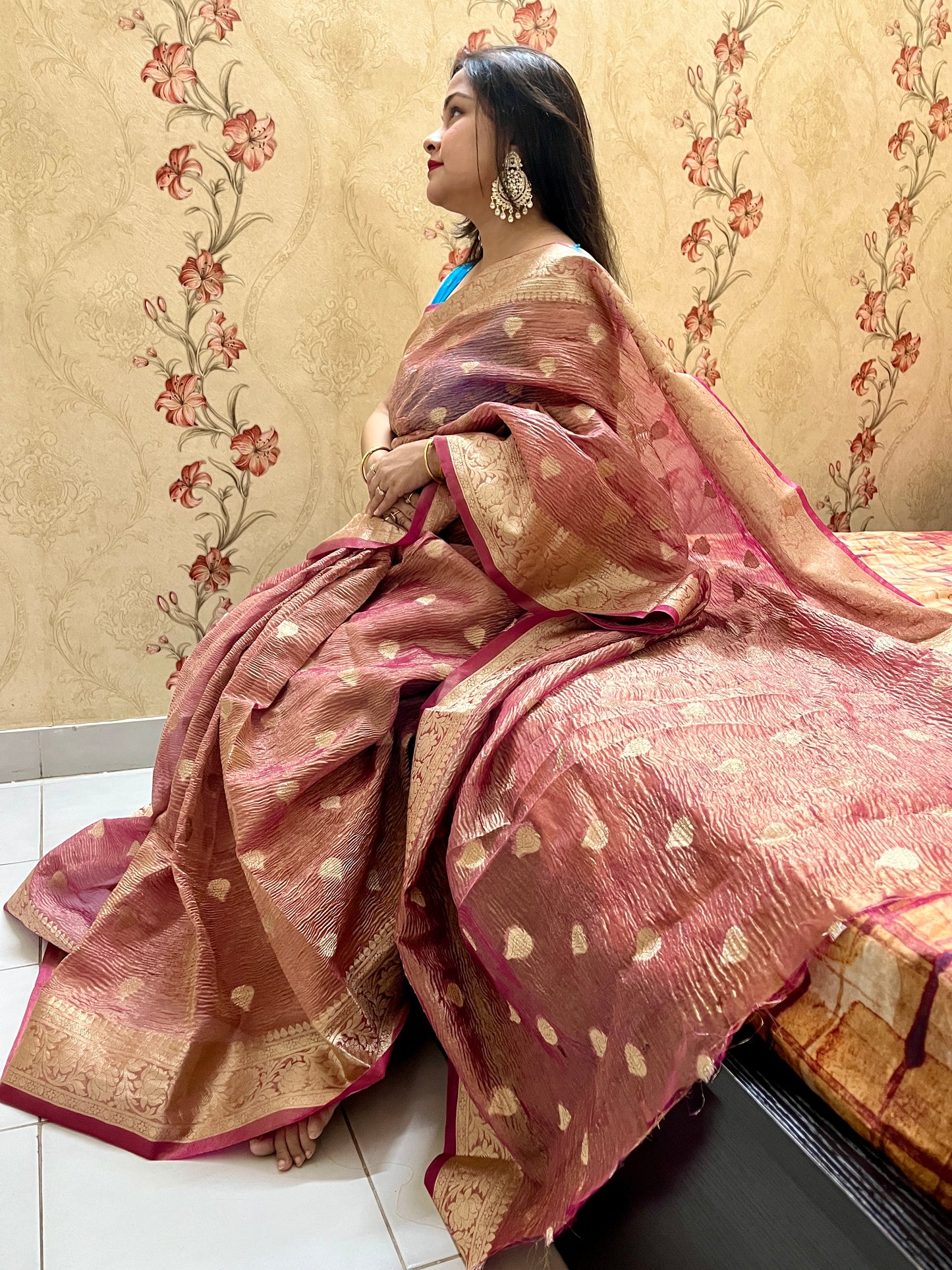 Elegant woman in Peach crush tissue saree showcasing Desi Aadat’s handwoven design