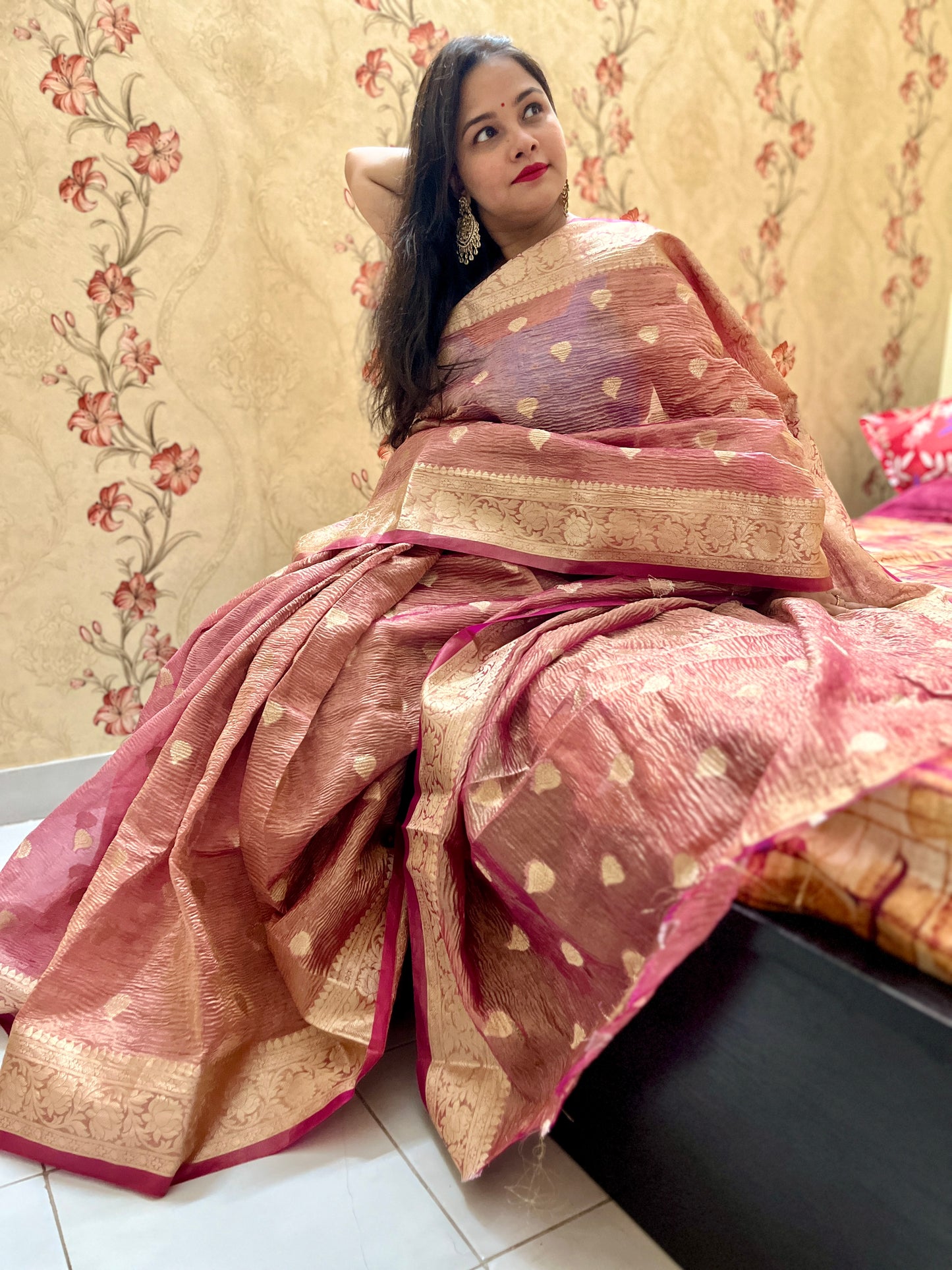 Close-up of crushed silk tissue fabric on Peach banarasi tissue saree