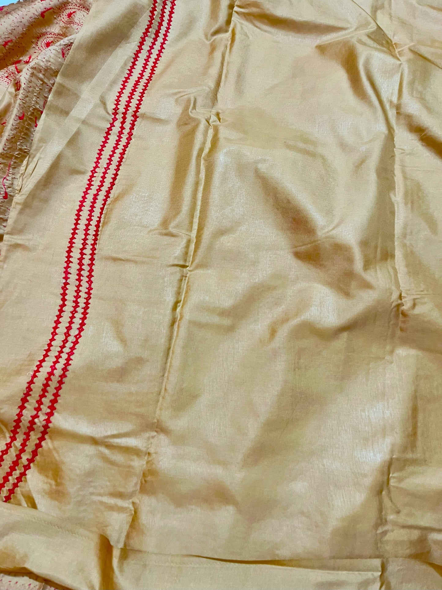 Matching golden yellow blouse piece with coordinating paisley Kantha stitch details