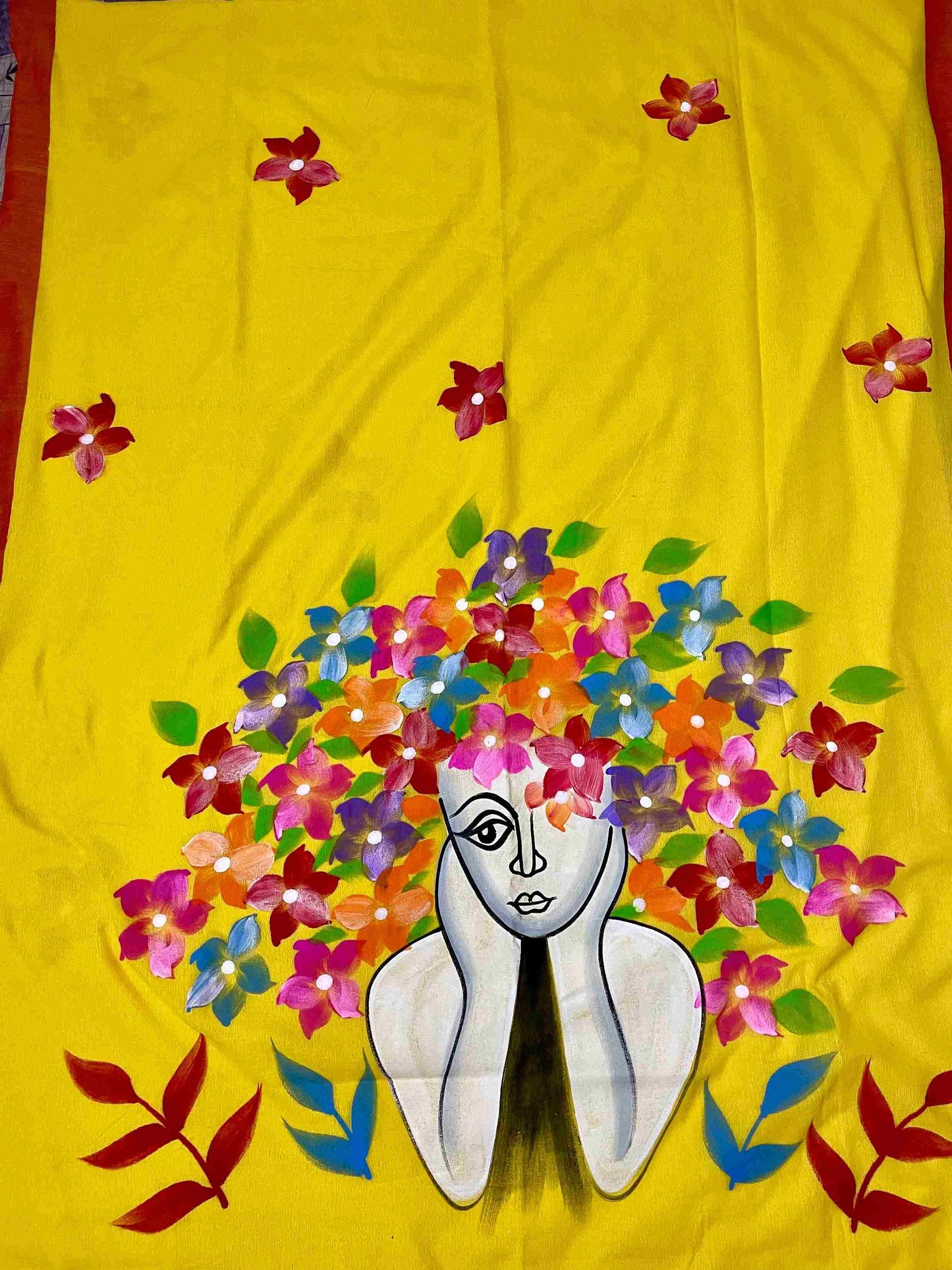 Close-up of hand-painted doll design on Yellow mul mul cotton saree
