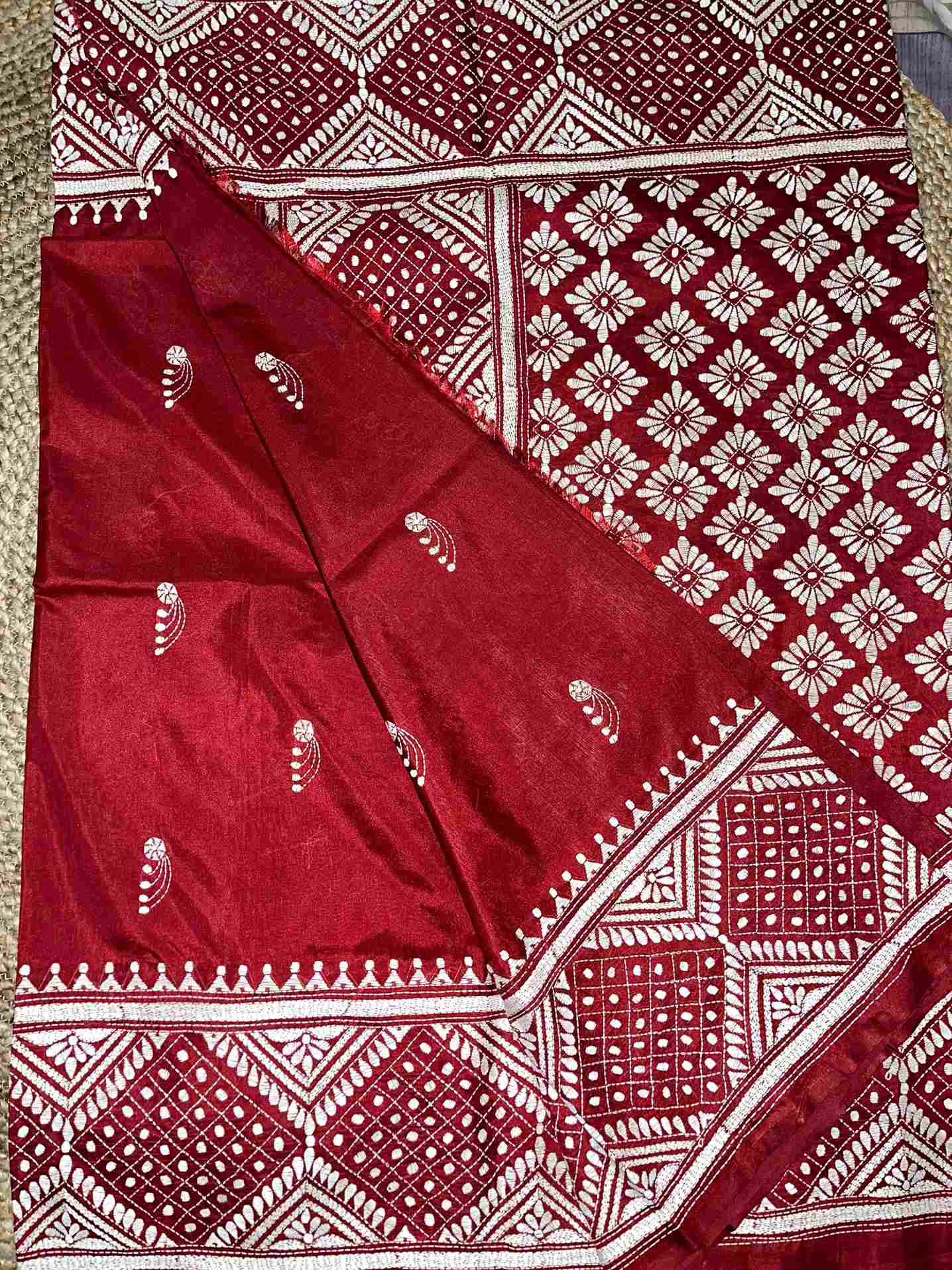 Close-up of Kutch work saree and Kantha stitch details on Maroon Red silk