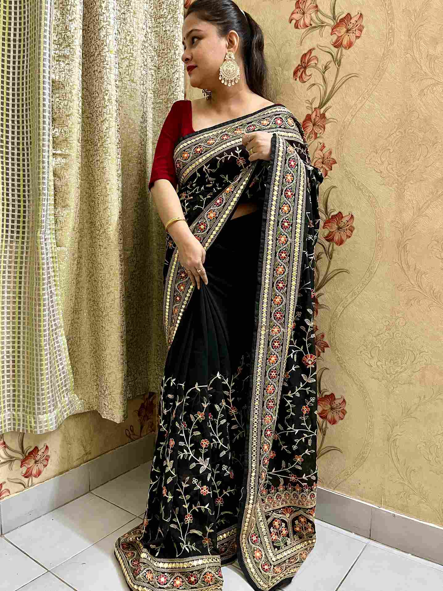 Elegant woman in Black georgette saree showcasing Desi Aadat’s party wear design