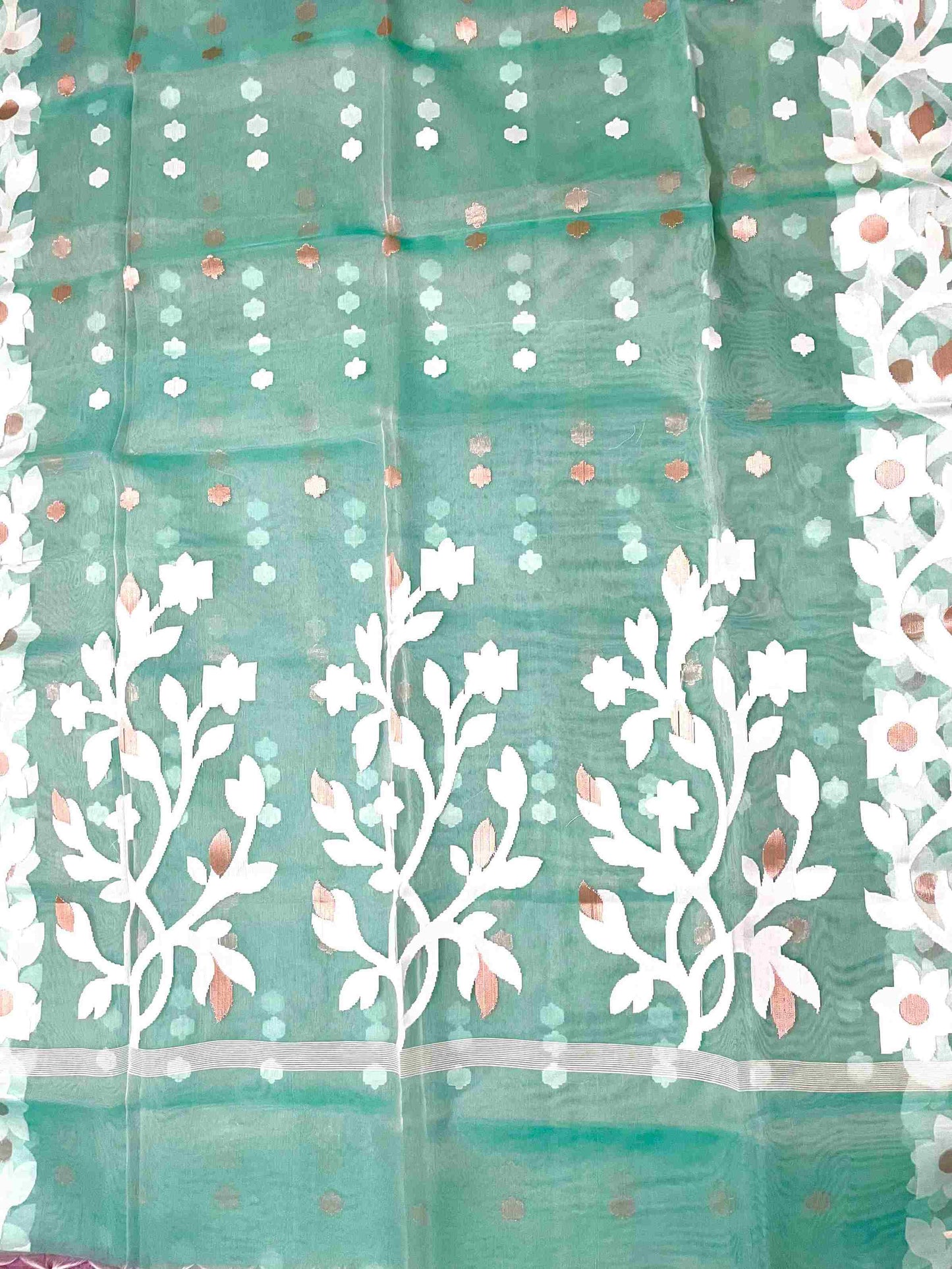 Graceful woman in Sea Green handwoven saree showcasing Desi Aadat’s Jamdani design