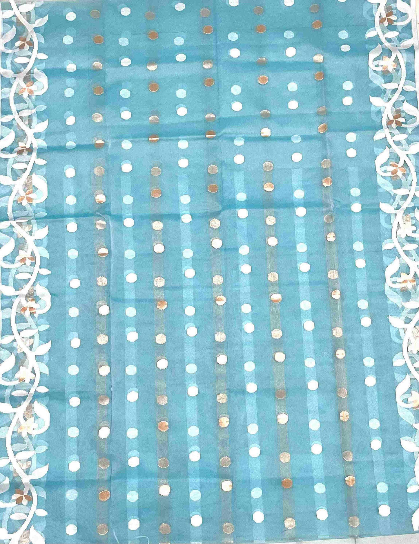 Elegant woman in Sky Blue handwoven saree showcasing Desi Aadat’s Jamdani design