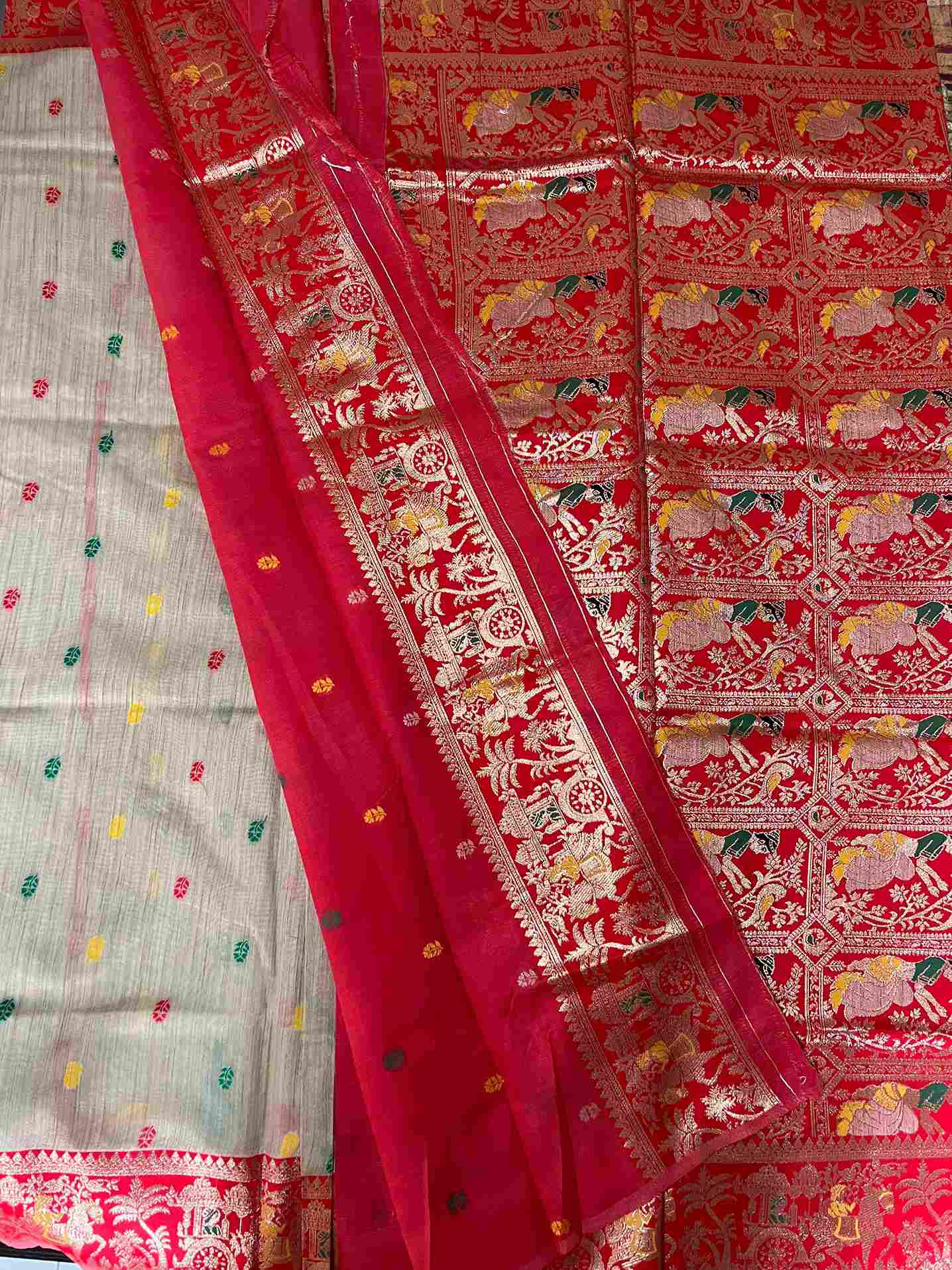 Close-up of Buti embroidery on cotton tissue saree fabric