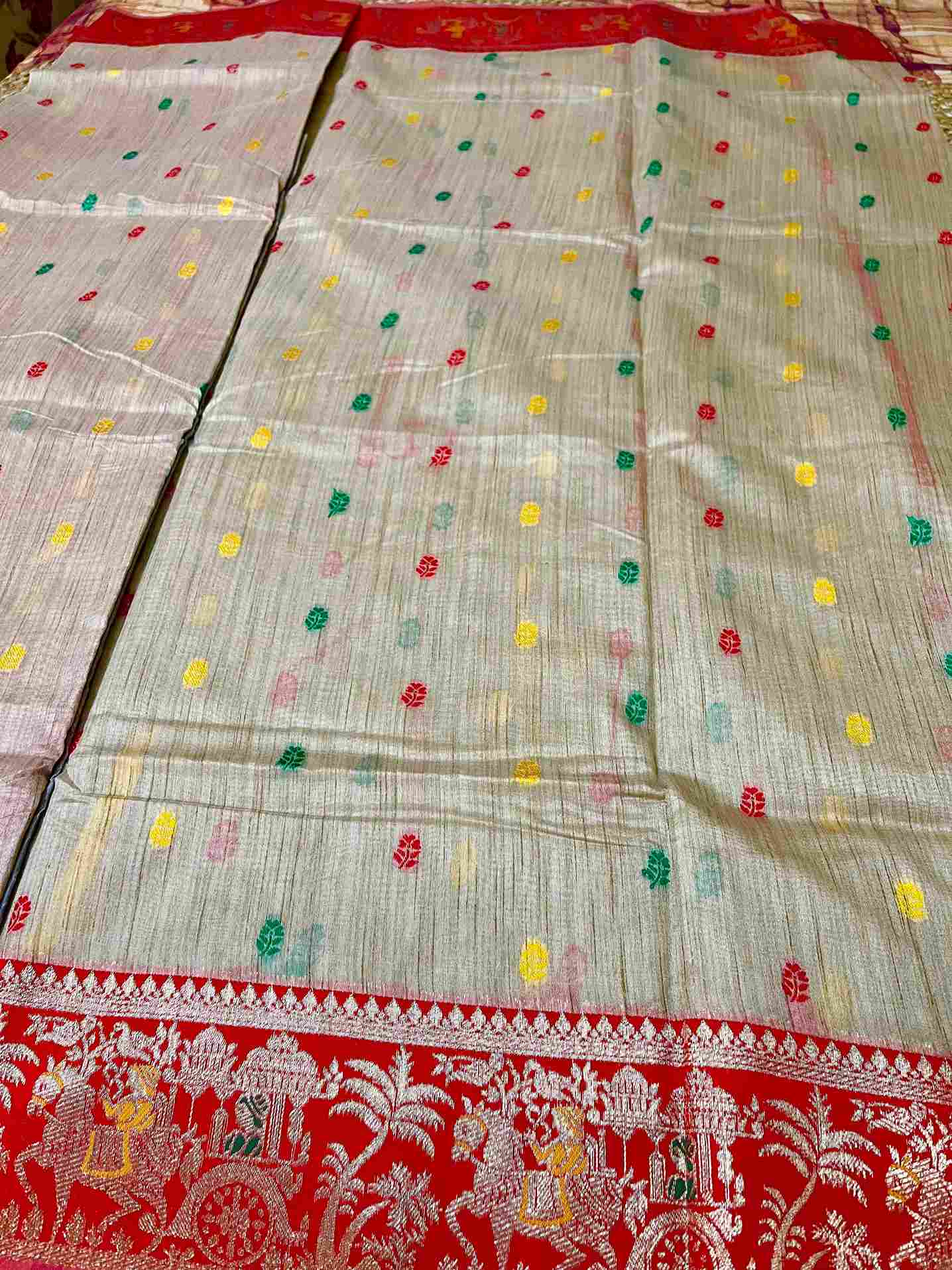 Close-up of Buti embroidery on cotton tissue saree fabric