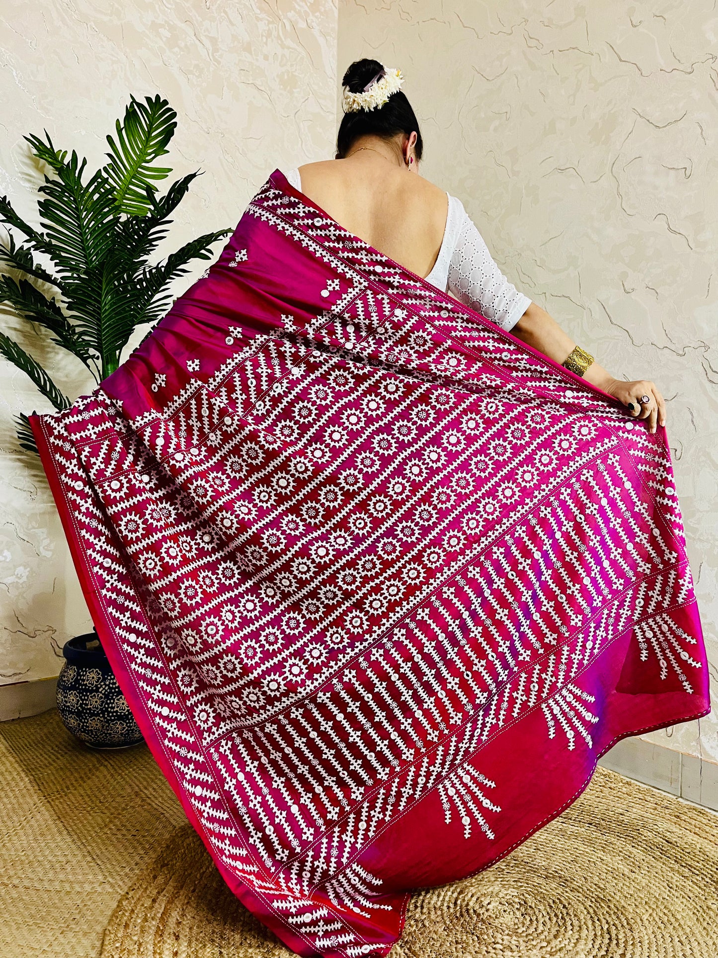 A women wearing Wine red Gujarati Stitch Saree with precise Kutch geometric hand embroidery and mirror work by Desi Aadat