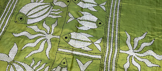Close-up of traditional Kantha running stitch technique showing hand embroidery