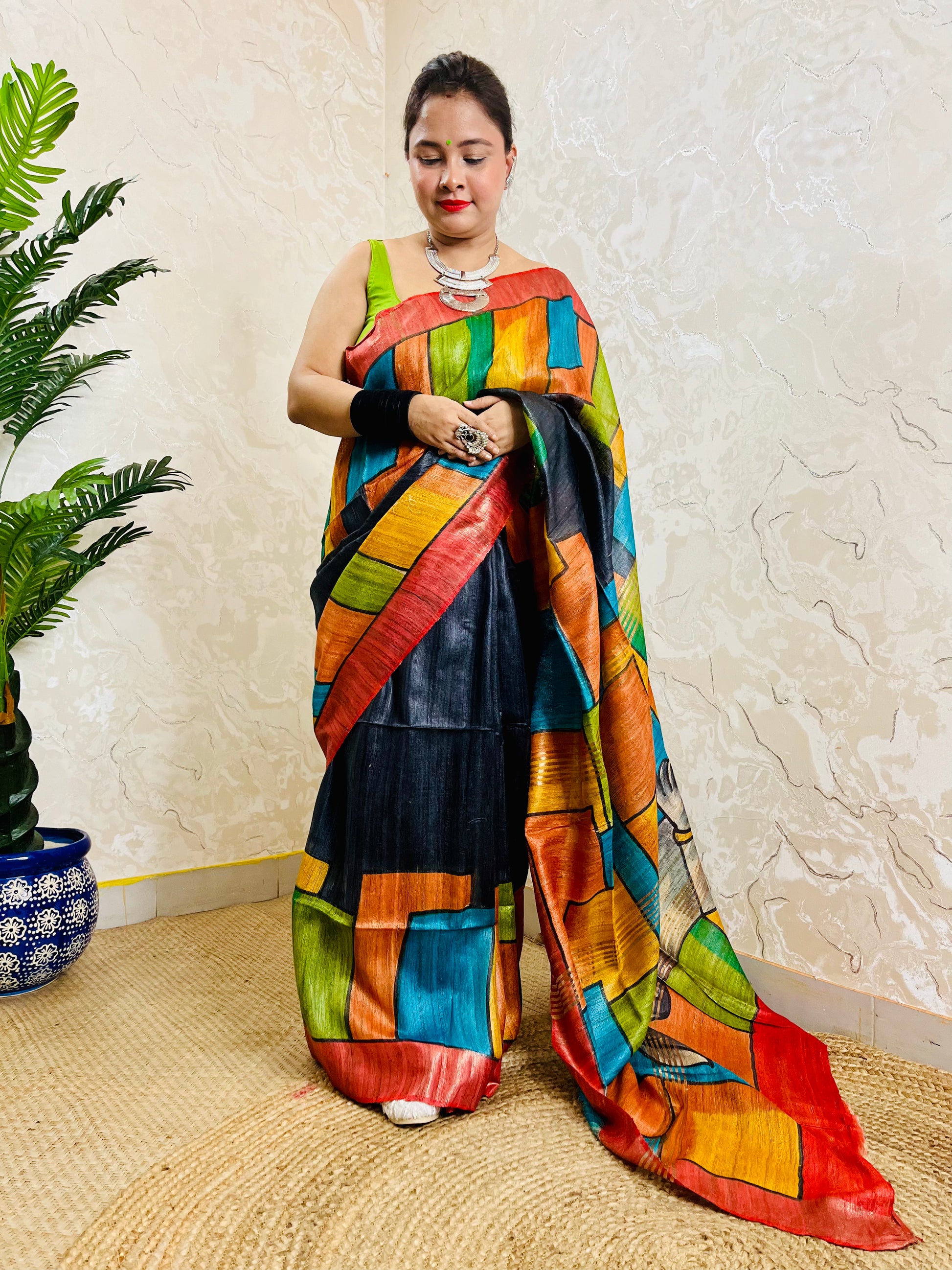 Close view of handpainted Ghicha silk saree texture and artistic pallu design
