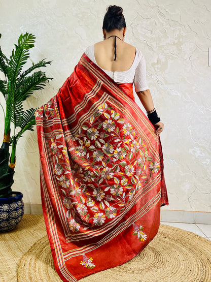 Back view of rust red batik silk saree with Kantha floral pallu and hem border