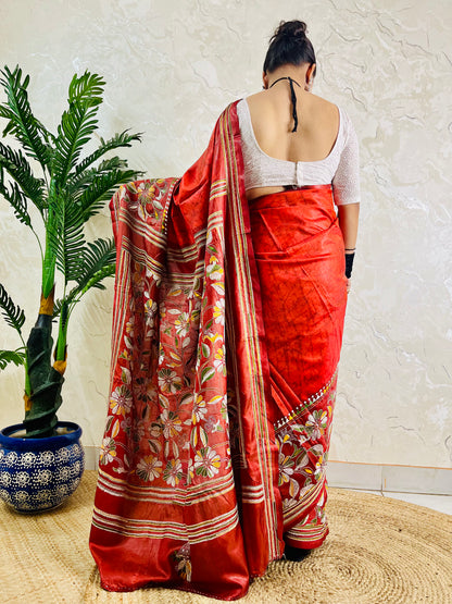Back view of rust red batik silk saree with Kantha floral pallu and hem border