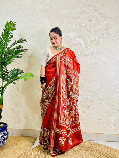 Front view of rust red batik Kantha saree on Bangalore silk with floral pallu