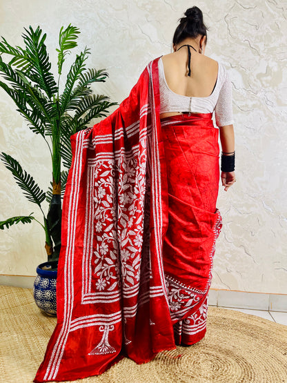 Back view of crimson red batik Kantha saree with floral border pallu