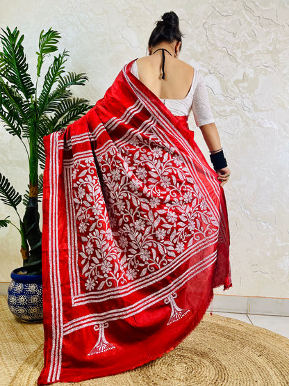 Back view of crimson red batik Kantha saree with floral border pallu