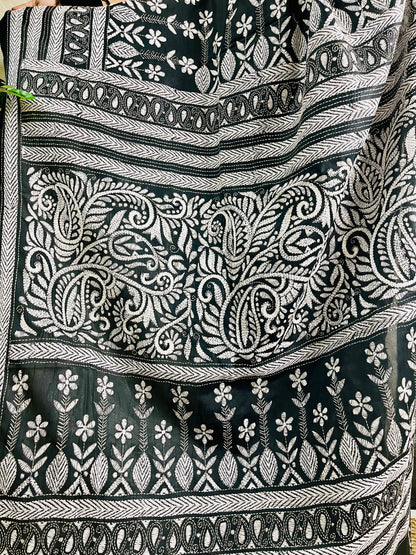 Detailed view of the multi-tiered white thread Katha embroidery on black Bangalore silk showing paisley and floral motifs