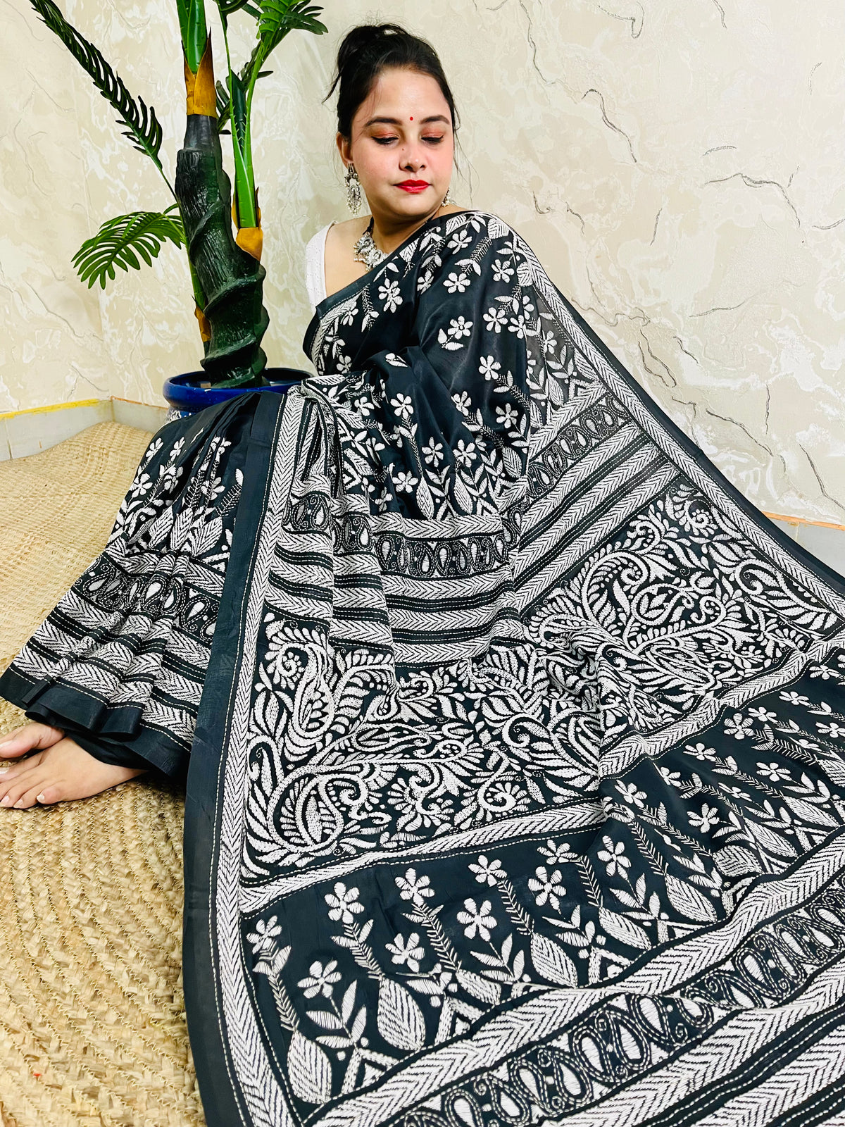 Front view of model wearing the affordable luxury black Bangalore silk saree with white Katha stitch floral and geometric detailing