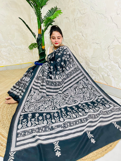Front view of model wearing the affordable luxury black Bangalore silk saree with white Katha stitch floral and geometric detailing