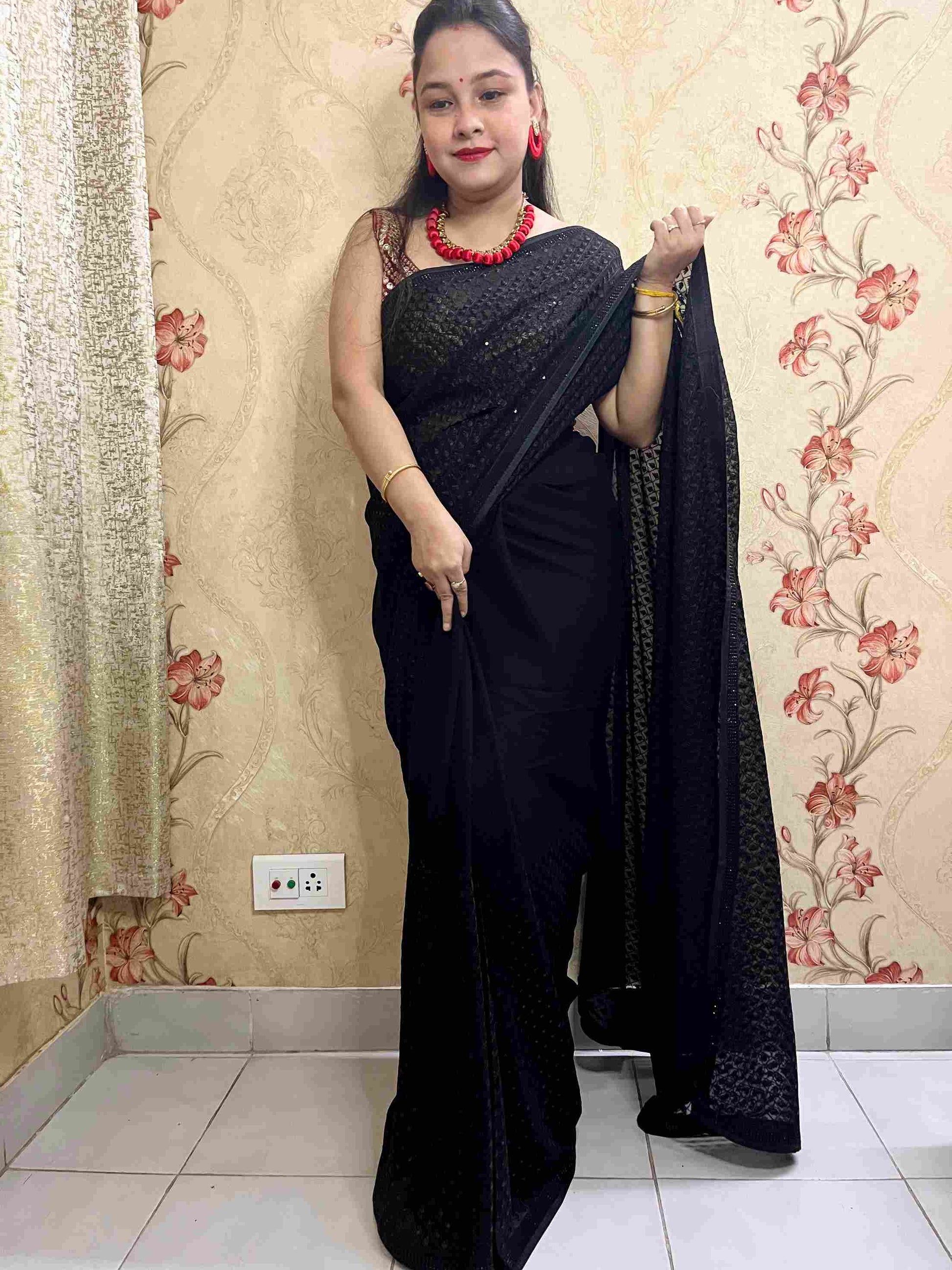 Close-up of Intricate Sequence Work on Black Georgette Fabric