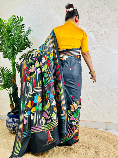 Black Kantha stitch saree with multicolour lotus motif, back standing view