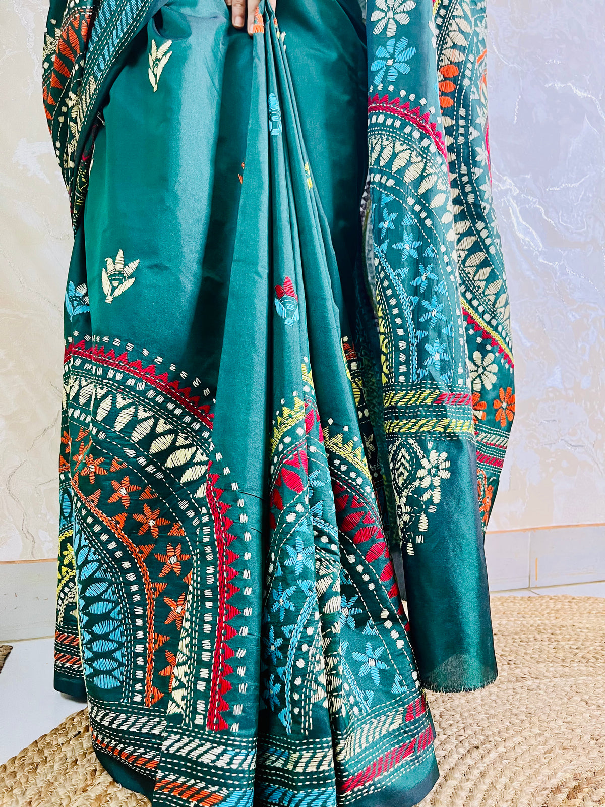 Extreme close-up of the detailed Katha stitch running embroidery, depicting multi-colored concentric circles and floral patterns within the Mandala.