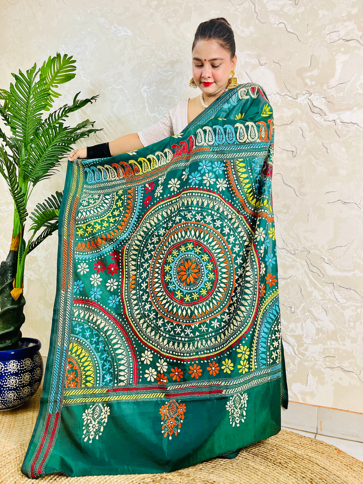 Full-length display of the handcrafted saree, highlighting the multi-colored Katha stitch Mandala center and paisley border on the pallu.