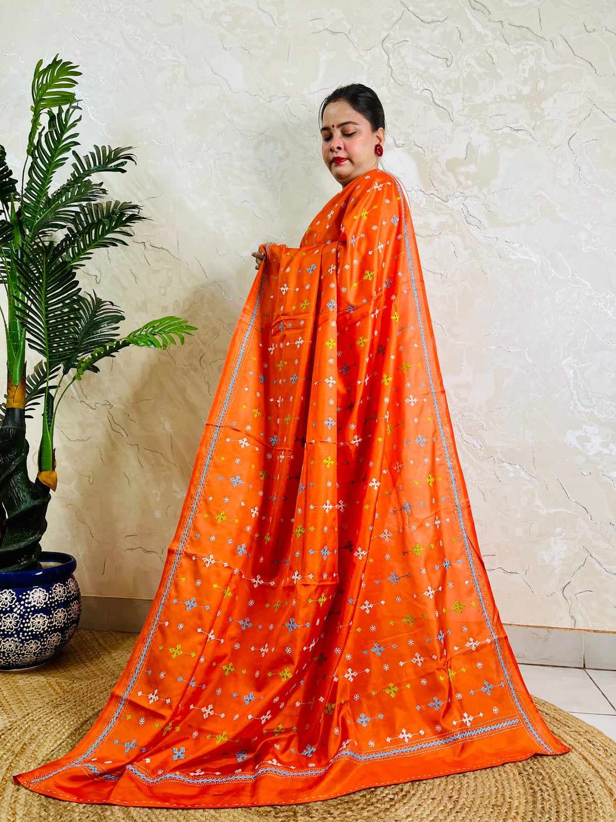 Bright orange Gujarati stitch saree on Bangalore silk, full drape standing pose