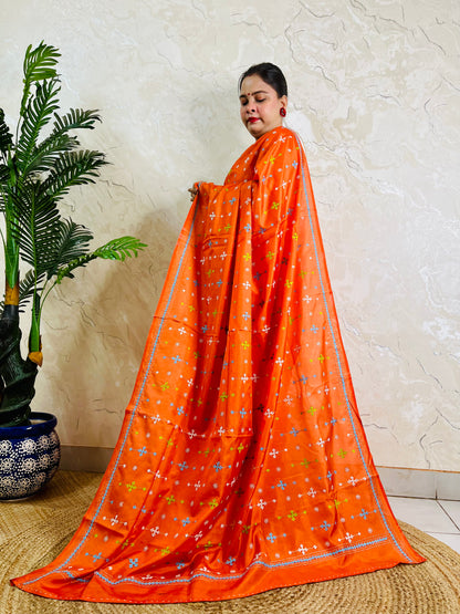 Bright orange Gujarati stitch saree on Bangalore silk, full drape standing pose