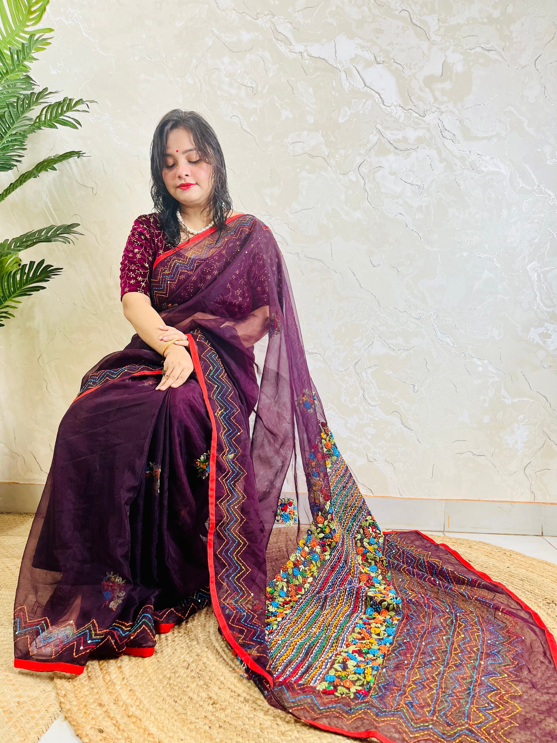 Handmade Jamun purple organza silk saree with multicolour Bullion Stitch floral embroidery and zigzag running stitch — side sitting drape view, Desi Aadat
