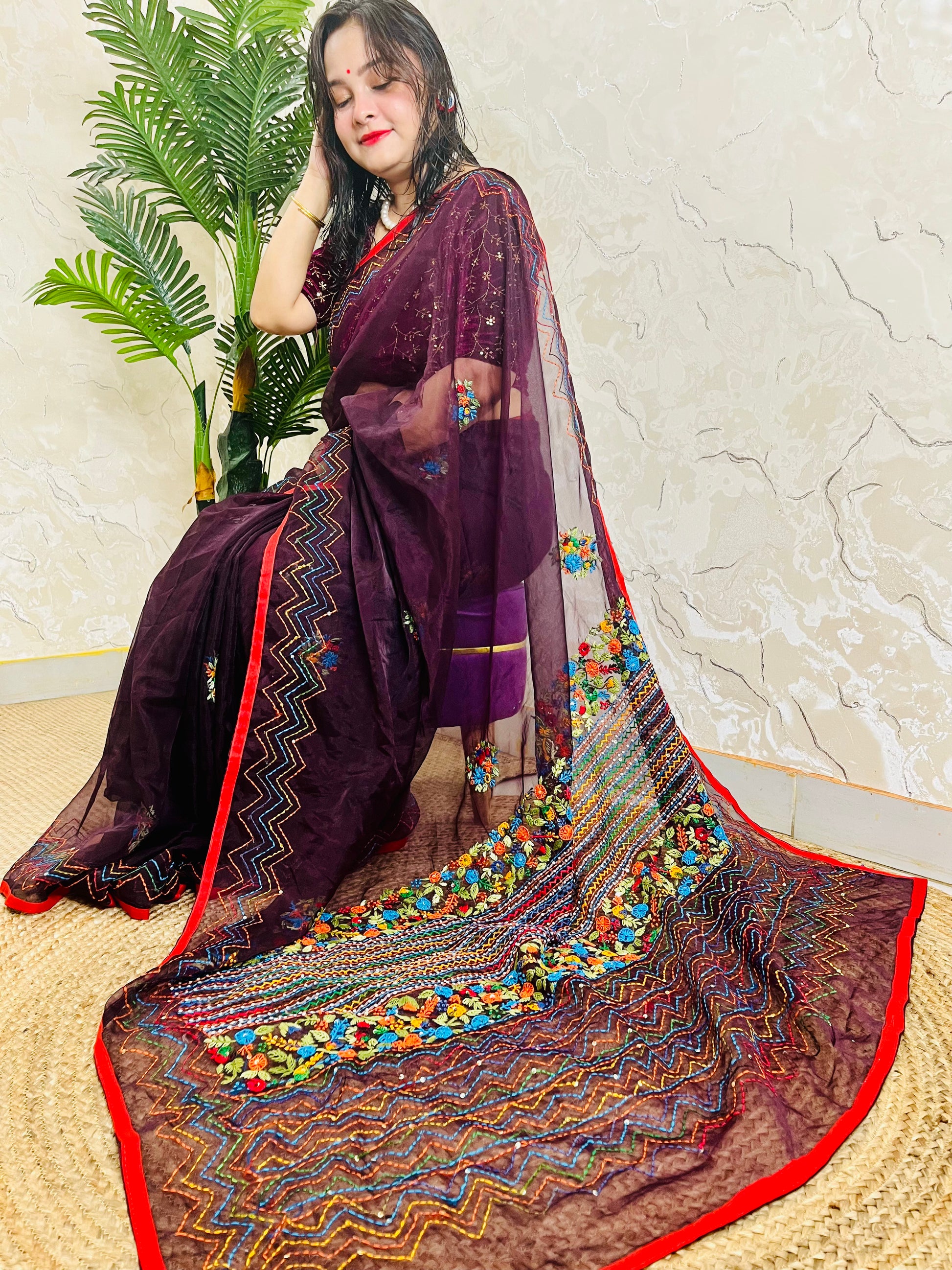 Handmade Jamun purple organza silk saree with multicolour Bullion Stitch floral embroidery and zigzag running stitch — side sitting drape view, Desi Aadat