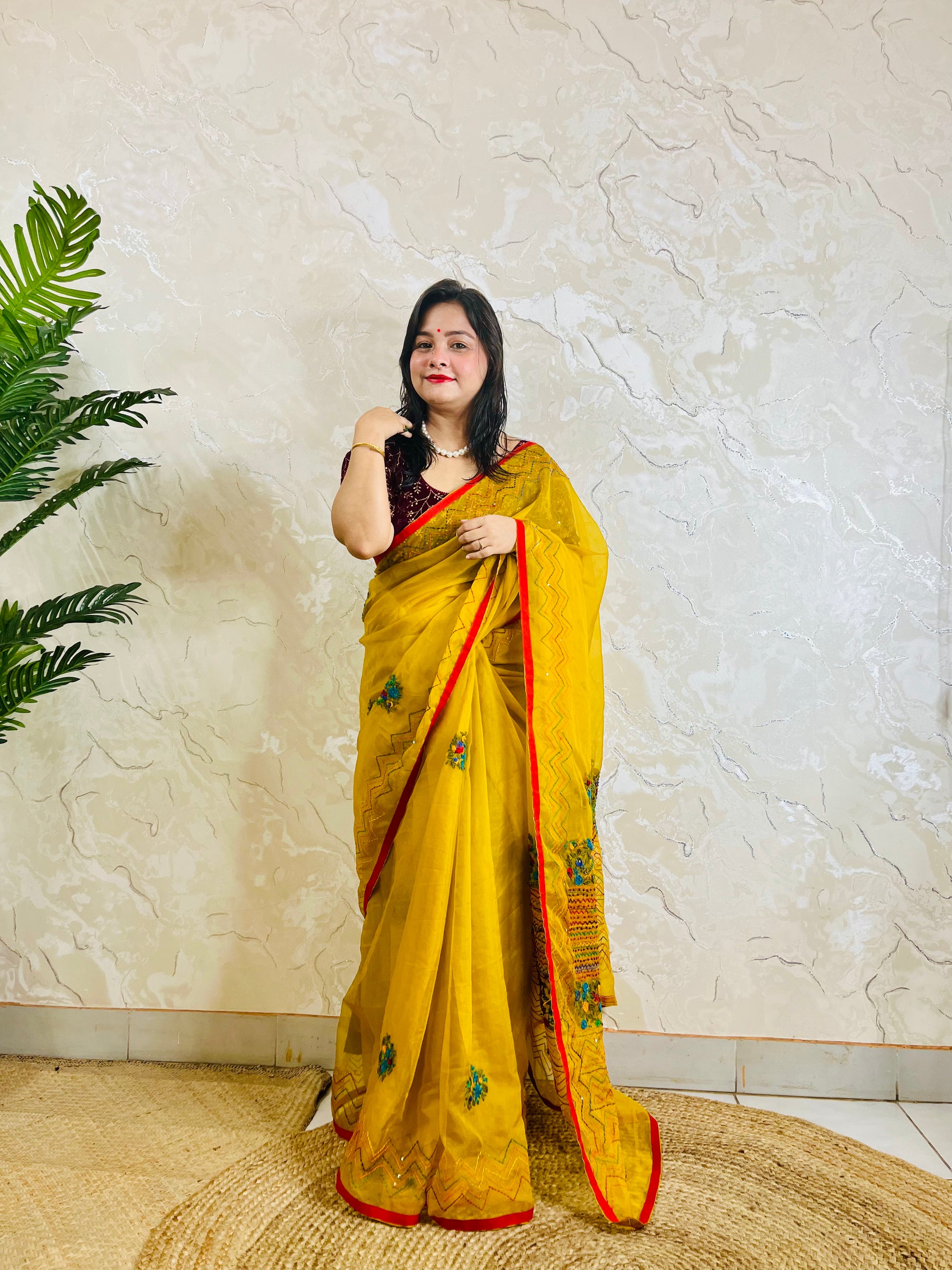 Limited edition mustard yellow Bullion Stitch French Knot organza silk saree draped on model — full front standing view by Desi Aadat