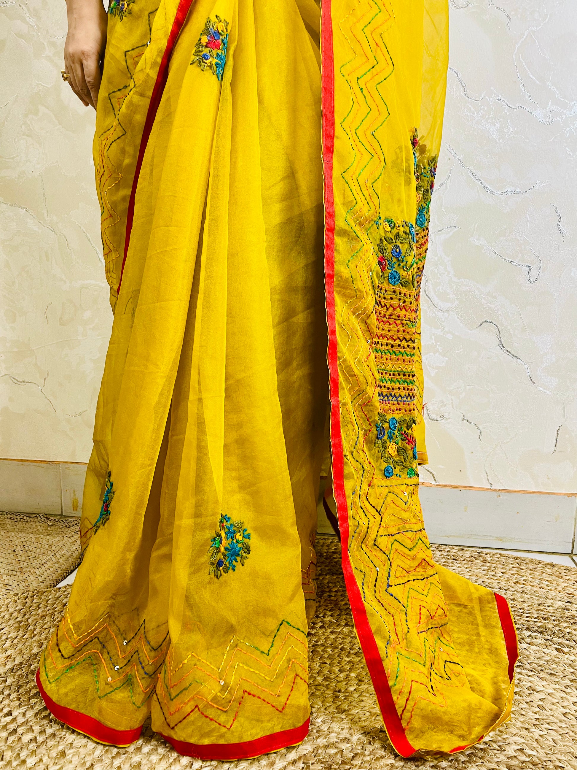 Close-up of Bullion Stitch florals and French knot embroidery on handcrafted mustard yellow pure organza silk saree — Desi Aadat