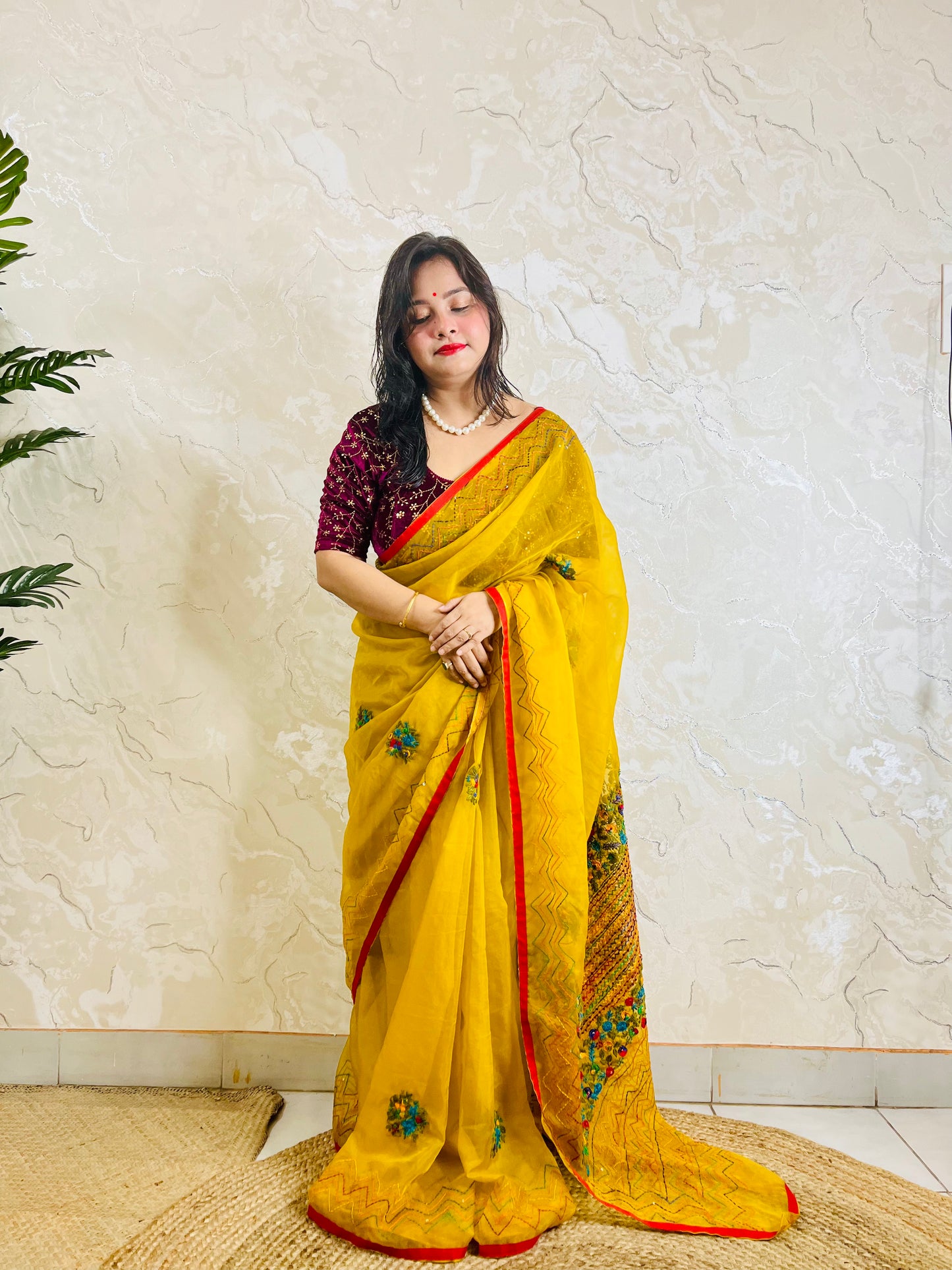 Limited edition mustard yellow Bullion Stitch French Knot organza silk saree draped on model — full front standing view by Desi Aadat