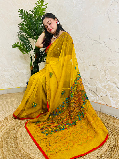 Mustard yellow handmade organza silk saree with multicolour Bullion Stitch and zigzag running stitch embroidery — side sitting drape view, Desi Aadat