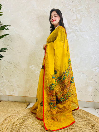 Limited edition mustard yellow Bullion Stitch French Knot organza silk saree draped on model — full front standing view by Desi Aadat