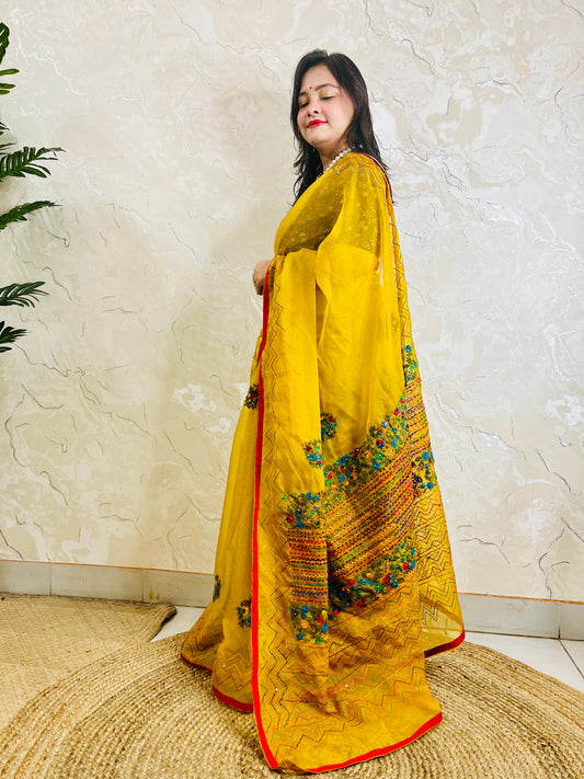 Limited edition mustard yellow Bullion Stitch French Knot organza silk saree draped on model — full front standing view by Desi Aadat